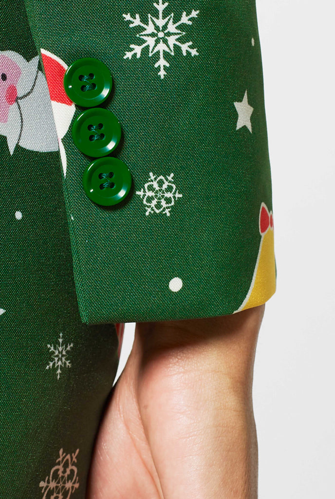 Woman wearing green suit with Christmas icons, sleeve close up